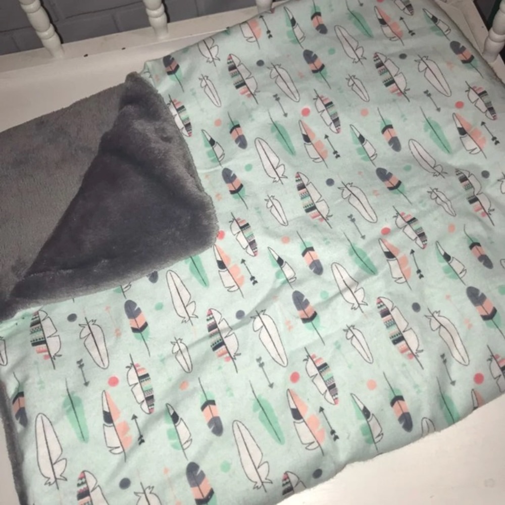 Handmade arrow and feather blanket